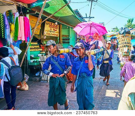 Kyaiktiyo, Myanmar - February 16, 2018: The Elderly Pilgrims Often Use The Porters To Visit Kyite Ht