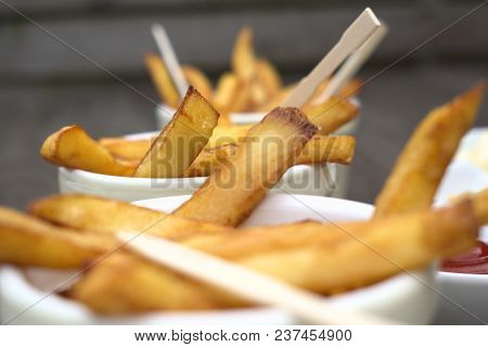 Tasty Food, Nutrition, Kitchen And Culinary Concept: Homemade Fries In Bowls For Snacks On Wooden Ba