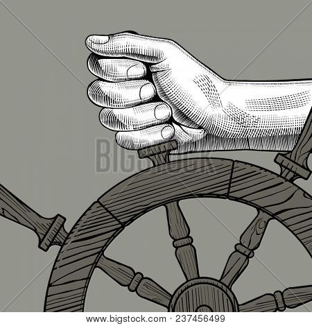 Hands of man holding a steering wheel. Vintage engraving stylized drawing