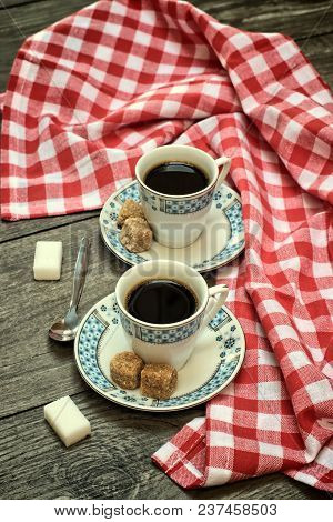 Caffeine Design Concept-old Kettle For Coffee, Coffee Cups On A Wooden Background With A White Red C