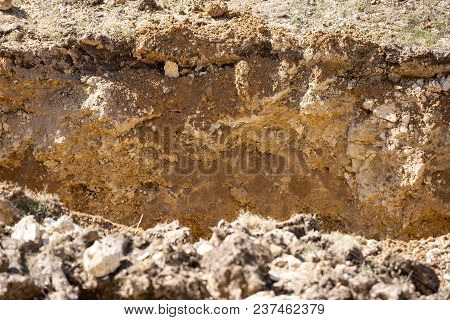 Cut Of Soil With Different Layers On Constraction Site