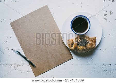 Mockup Blank Craft Sheet Of Blank Craft Paper, Pen, And Morning Coffee Cup With Croissant On White W