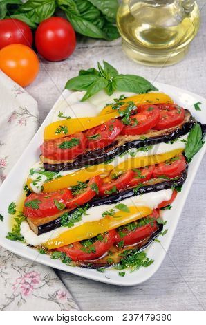 Baked Eggplants With Tomatoes, Yellow Pepper And Slices  Mozzarella