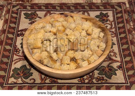 Rusk Squares Made Of Wheat Sourdough Bread In A Wooden Bowl Stand On A Table On A Colored Homemade N
