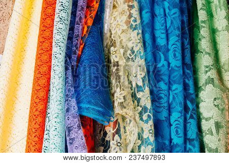 Different Types Of Fabrics Are Folded Neatly In A Row