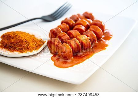 Tasty german sausage served with sauce