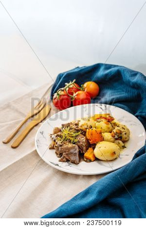 Beef meat stewed with potatoes-Traditional French cuisine Beef Bourguignon potatoes carrots in persillade