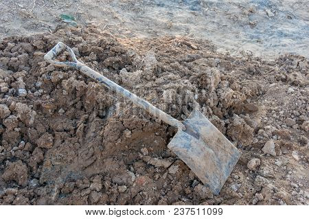Pile Of Dirt, Soil And Shovel. Construction, Digging Scene, Background