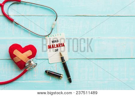 World Malaria Day April 25, Healthcare And Medical Concept. Stethoscope, Red And Black Heart, Thermo