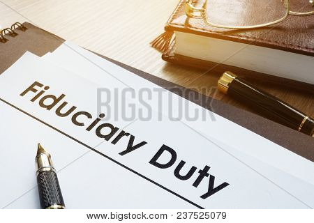Documents With Title Fiduciary Duty On A Desk.