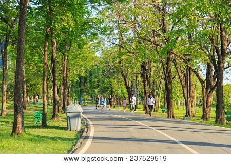 Bangkok, Thailand - April 21, 2018: Young Asian People Are Running In The Publick Park At Evening.