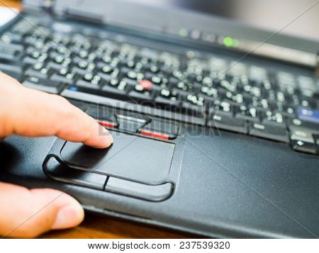 Close Up Finger On Laptop Touch Pad