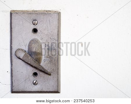 Old Vintage Light Switch On The Wall