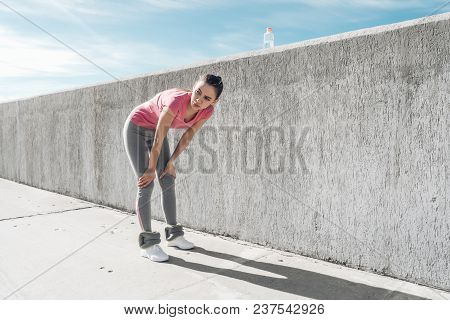 Young Sport Girl Regains Her Breath After The Race, A Long Marathon