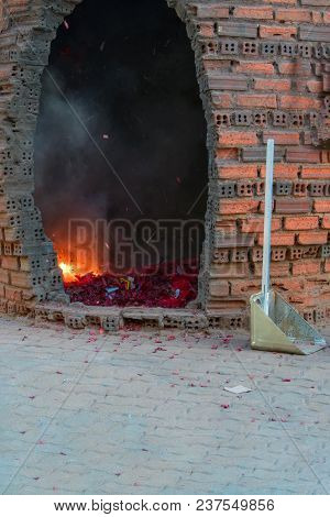 Buddhist Ritual Of Exorcising Evil Spirits Through The Explosion Of Firecrackers Near The Temple. Co