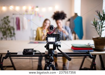 A Camera With A Slider. Unrecognizable Creative Women In A Studio. Startup Business.