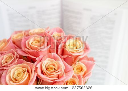 Roses In A Round Box And The Bible. Beautiful Pink Roses On A White Wooden Background. Beautiful Pin