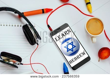 Smartphone With Israel Flag And Headphones. Concept Of Hebrew Learning Through Audio Courses