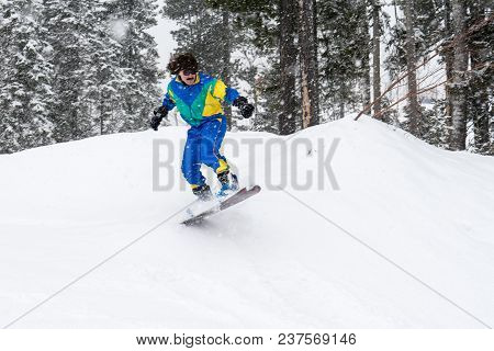 Vintage Photo Of Young Man Snowboarder In The Mountains. Retro Style. 1980 Concept.