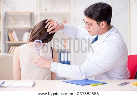 Doctor checking patients joint flexibility with gonimeter