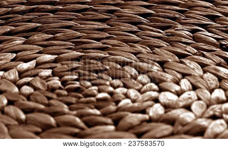 Round Straw Mat Texture With Blur Effect In Brown Tone. Abstract Background And Texture For Design.