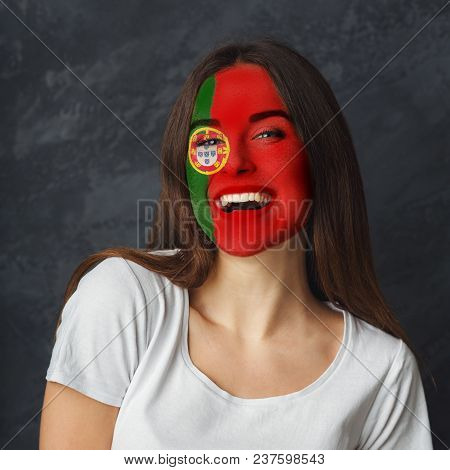 Face Of Young Happy Woman Painted With Flag Of Portugal. Football Or Soccer Team Fan, Sport Event, F