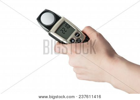 Man Holds In His Hand An Instrument For Measuring Illumination