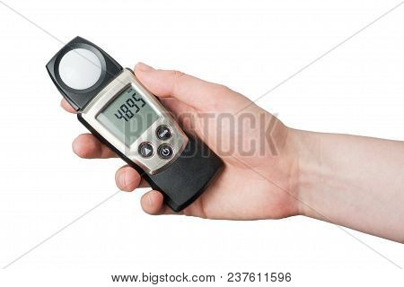 Hand Holding Light Exposure Meter, A Photograph Device For Measuring Illumination On White Backgroun
