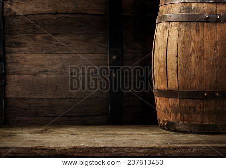 Oktoberfest Beer Barrel And Beer Glasses With Wheat And Hops On Wooden Table.