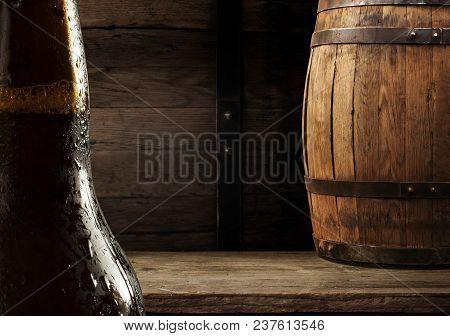 Oktoberfest Beer Barrel And Beer Glasses With Wheat And Hops On Wooden Table.