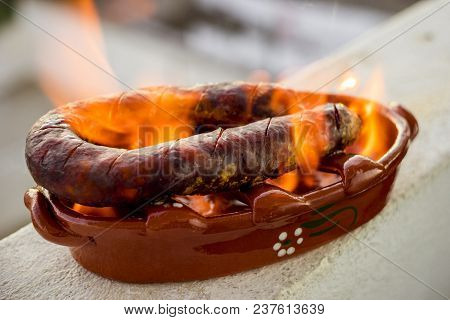Traditional Portuguese Chourico Or Spanish Chorizo Prepared In A Special Clay Pot