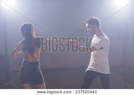 Young Couple Dancing Social Danse Kizomba Or Bachata Or Semba Or Taraxia In Dancing Class Background