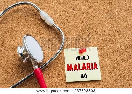 World Malaria Day April 25, Healthcare And Medical Concept. Stethoscope, Handmade Red Heart, Thermom