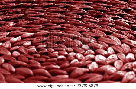 Round Straw Mat Texture With Blur Effect In Red Tone. Abstract Background And Texture For Design.