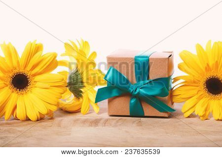 Little Gift Box With With Yellow Flowers In A Rustic Style