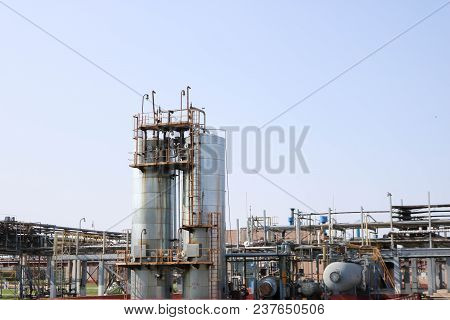 Two Huge High Metal Tanks, Barrels, Heat Exchange Equipment, Pumps, Pipes, Pipeline Estocad At The O