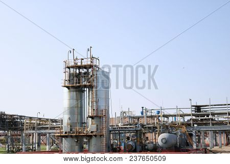 Two Huge High Metal Tanks, Barrels, Heat Exchanging Equipment, Pumps, Pipes, Pipeline Estocades With