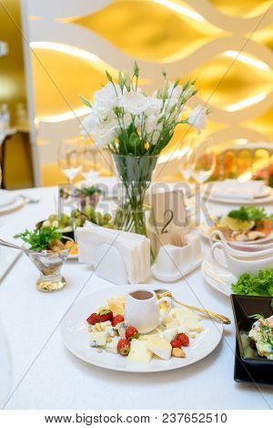 Cheese Plate With Strawberry, Peanut And Honey On Wedding Dinner Table, Selective Focus. Camembert, 