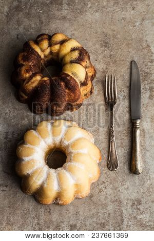 A Vanilla And Chocolate Bundt Cake And A Lemon Bundt Cake