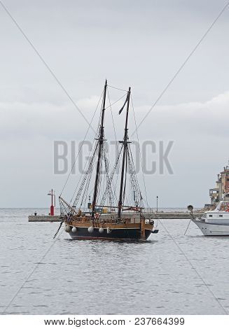 Old Wooden Sail Ship With Two Masts In Port