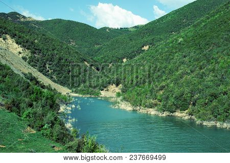 Landscape With Mountains, Forest And A River In Front. Beautiful Scenery Of The Nature In Albania