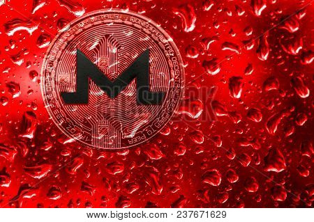 Coin Monero Behind Glass With Red Drops. Blood On Bitcoin. Terrorism, War, Extortion, Crimes For Mon