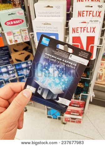 Montreal, Canada - March 31, 2018 : A Hand Holding American Express Gift Card. The American Express 