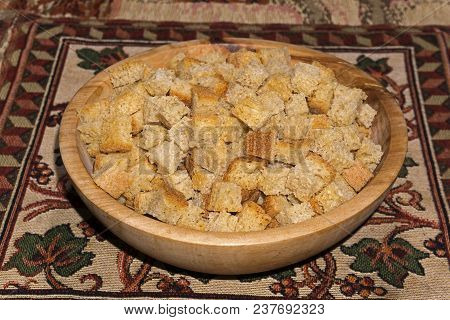 Rusk Squares Made Of Wheat Sourdough Bread In A Wooden Bowl Stand On A Table On A Colored Homemade N