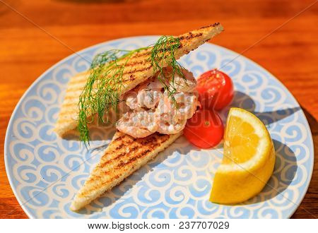 Toast Skagen, Classic Swedish Appetizer Of Shrimp And Caviar On Toast Served On A Plate With Lemon A