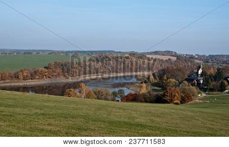 Talsperre Pohl Water Reservoir With Church In Altensalz Village And Autumn Landscape With Colorful F