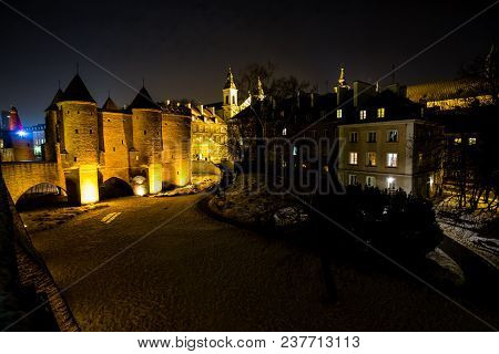 Warsaw Barbacan Fortress Castle In Winter Is In The Capital City Of Poland. Old Town Is The Historic
