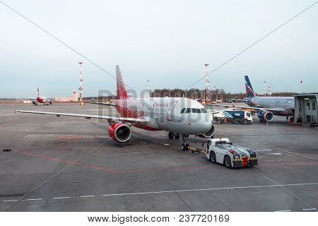 Airbus A-319 Push Back Tow Rossiya Russian Airlines. Russia, Saint-petersburg, Airport Pulkovo. 20 A