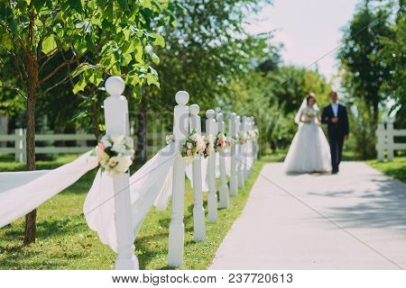 Guests Throwing Confetti Over Bride And Groom At Wedding