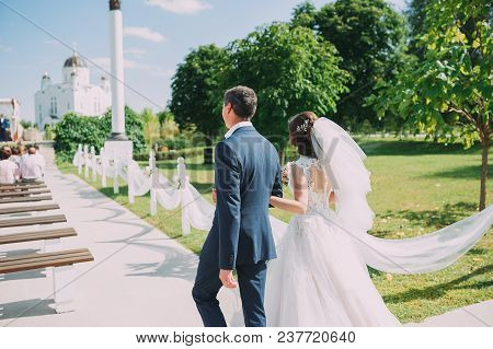 Guests Throwing Confetti Over Bride And Groom At Wedding